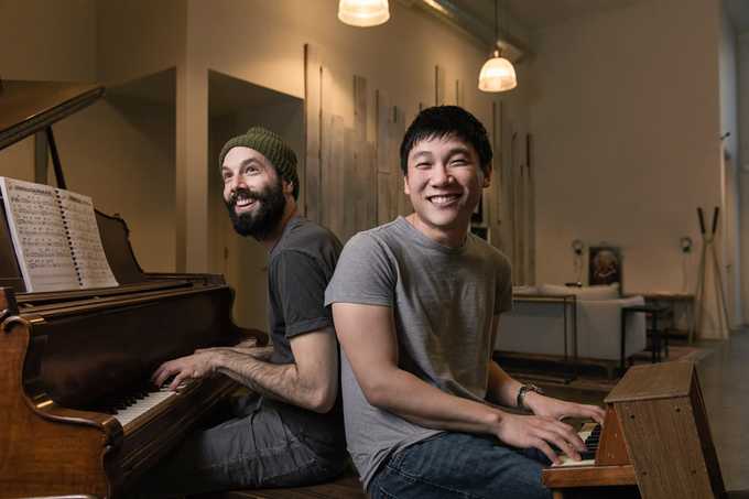 Jack Conte (left) playing the piano with his co-founder Sam Yam (right)